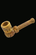A close-up of the Small Carved Marble Stone Pipe, showcasing its detailed stone carving and simple, rounded shape.