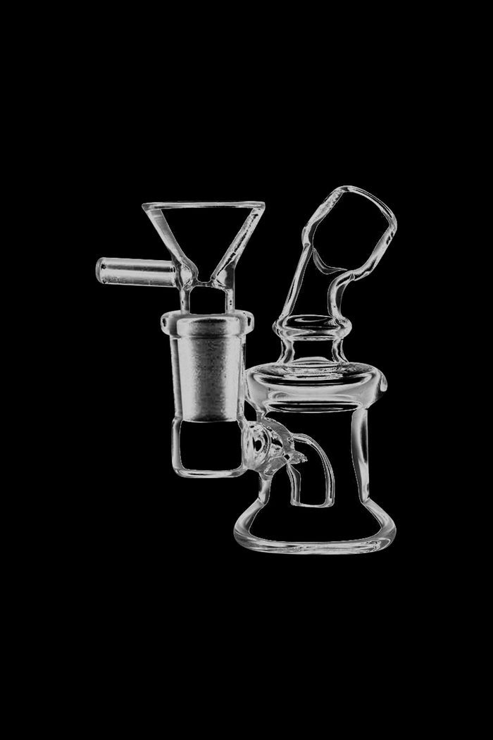 A slightly angled view of the Super Nano Travel Rig Bubbler, showcasing its compact size and clear glass construction.