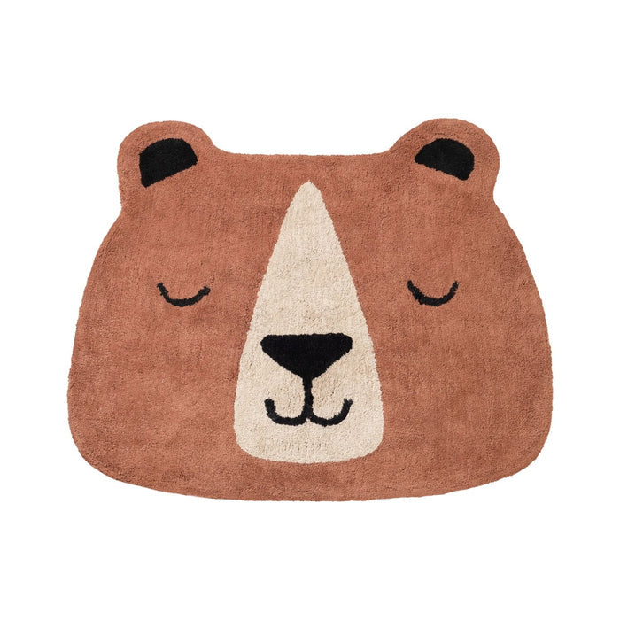Bear-shaped rug with a smiling face on a white background