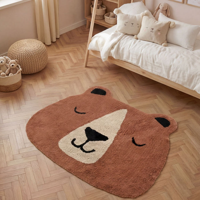 Bear-shaped rug on a wooden floor in a child's bedroom