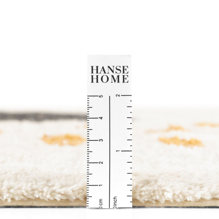 Hanse Home rug with a ruler for scale on a white background
