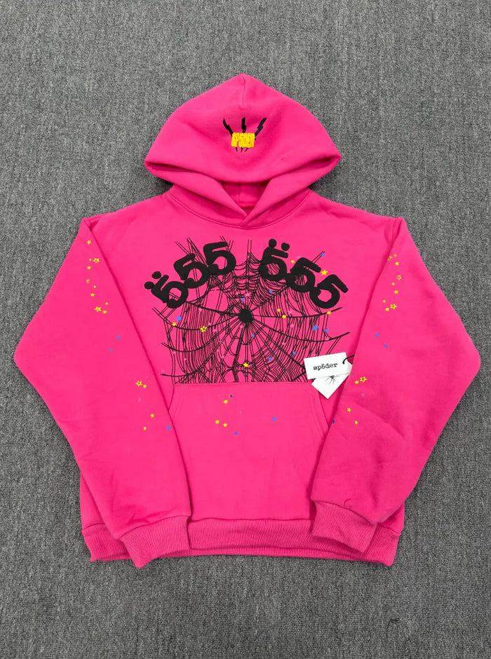 Hot pink Sp5der 555 pullover hoodie with spider web graphic and multicolor star print on sleeves