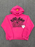 Hot pink Sp5der 555 pullover hoodie with spider web graphic and multicolor star print on sleeves