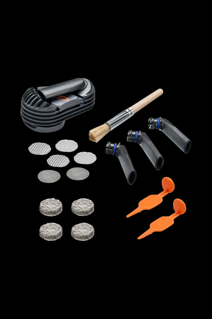 A flat lay of the Storz & Bickel Crafty Wear & Tear Set, showing several small, grey replacement parts arranged on a black background.