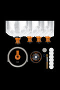 A top-down view of the Volcano Hybrid Starter Set, displaying multiple clear glass bags arranged in a row on a black background.