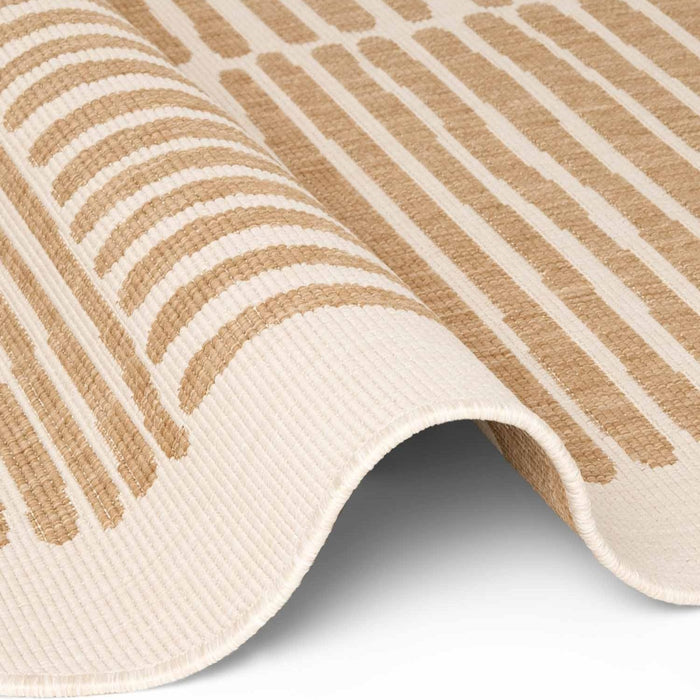 Close-up of a beige and white striped rug on a white background