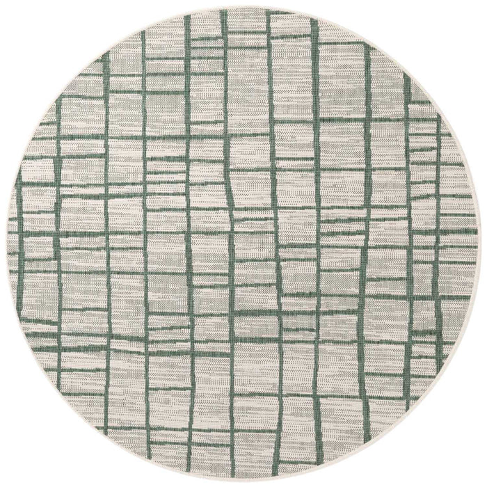 Round rug with green line pattern on a white background