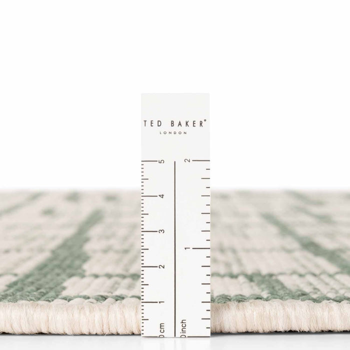 Ted Baker London rug with a ruler for scale on a white background