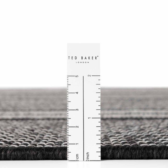 Ted Baker London rug with a ruler for scale on a white background