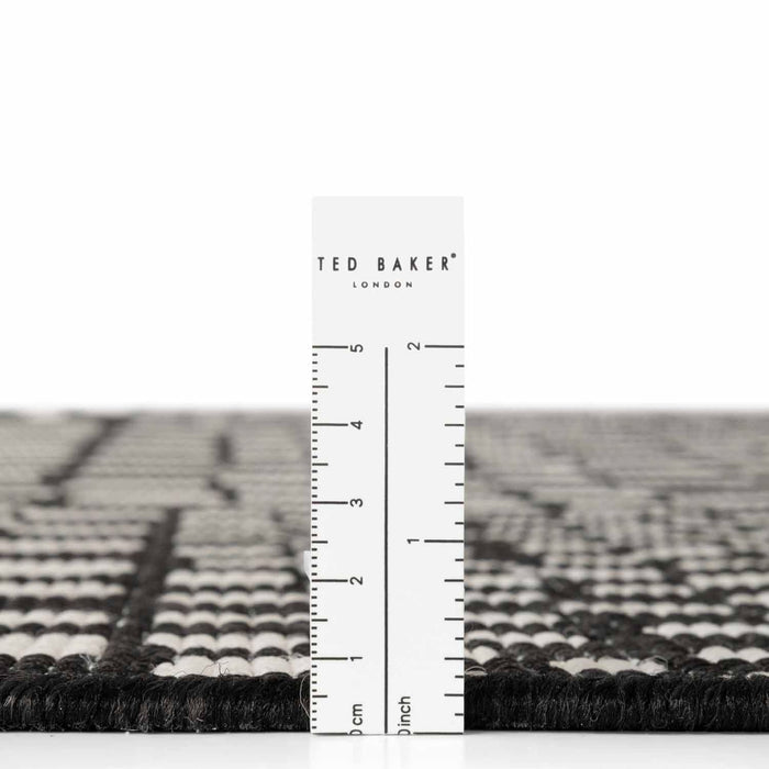 Ted Baker London rug with a ruler for scale on a white background