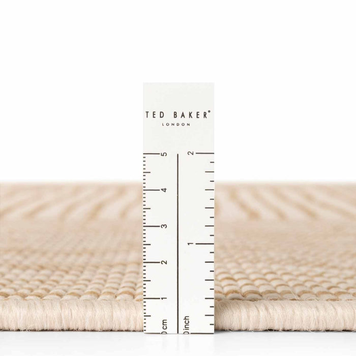 Ted Baker fabric swatch with a ruler for scale on a white background
