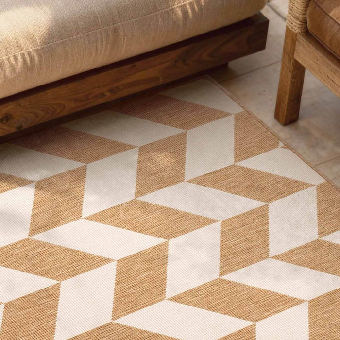 Geometric patterned rug with brown and beige colors on a wooden floor.