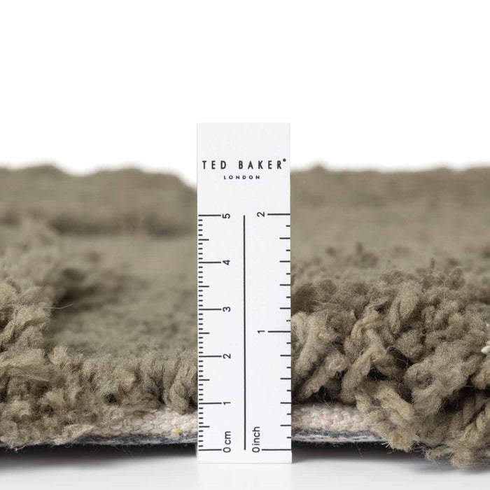 Textured fabric with a ruler and 'Ted Baker London' label