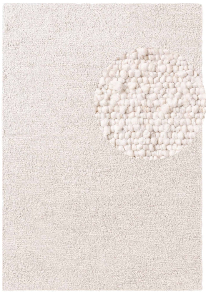 Textured white rug with a circular pattern