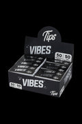 A close-up shot of the VIBES Rolling Tips Box - 50 Pack, displaying a stack of booklets with bold branding.