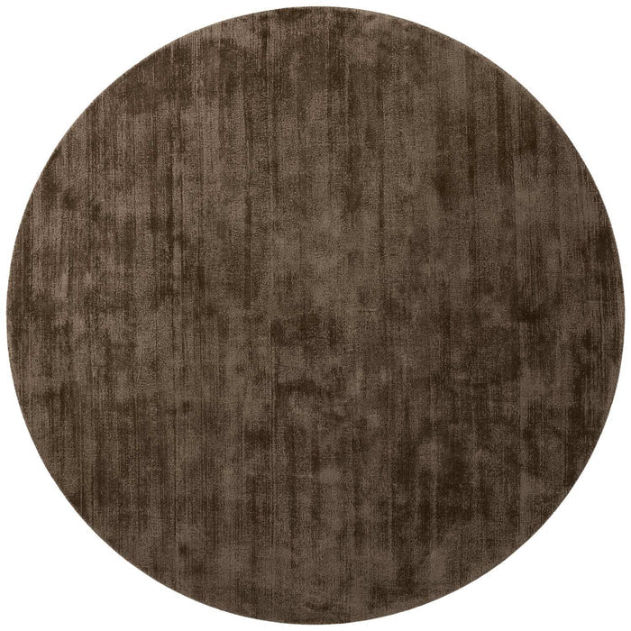 Round brown rug on a white background