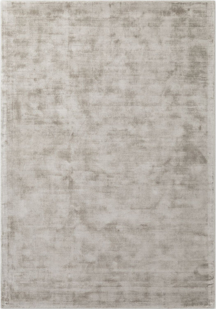 Textured area rug with a neutral color palette on a plain background