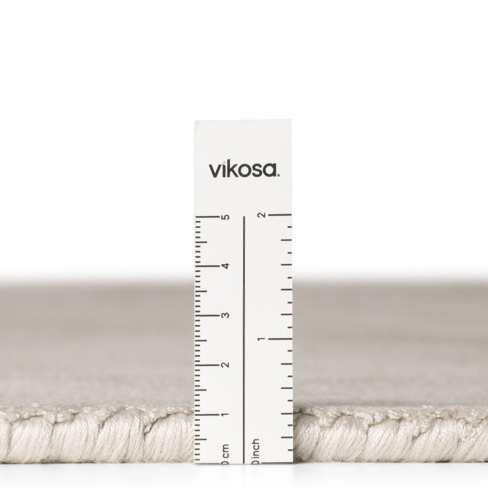 Vikosa yarn with a ruler for measurement on a white background