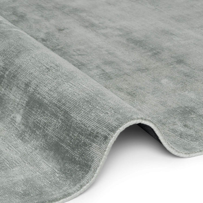 Close-up of a gray textured rug on a white background