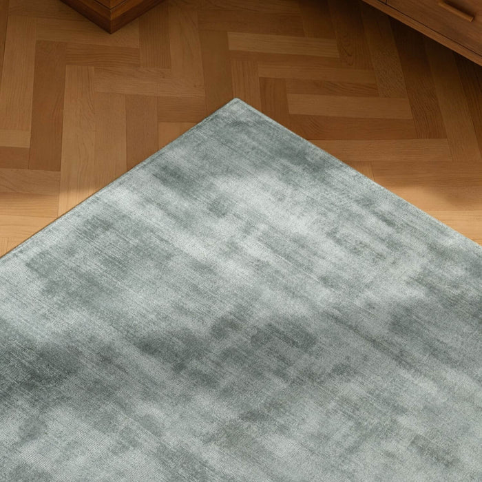 Gray rug on a wooden floor