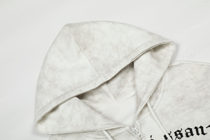 Close-up of white hood and shoulder seam with faded vintage wash texture