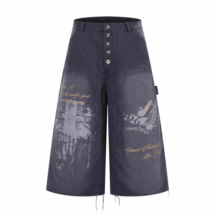 Front view of dark denim wide-leg shorts with button fly and vintage graphic print