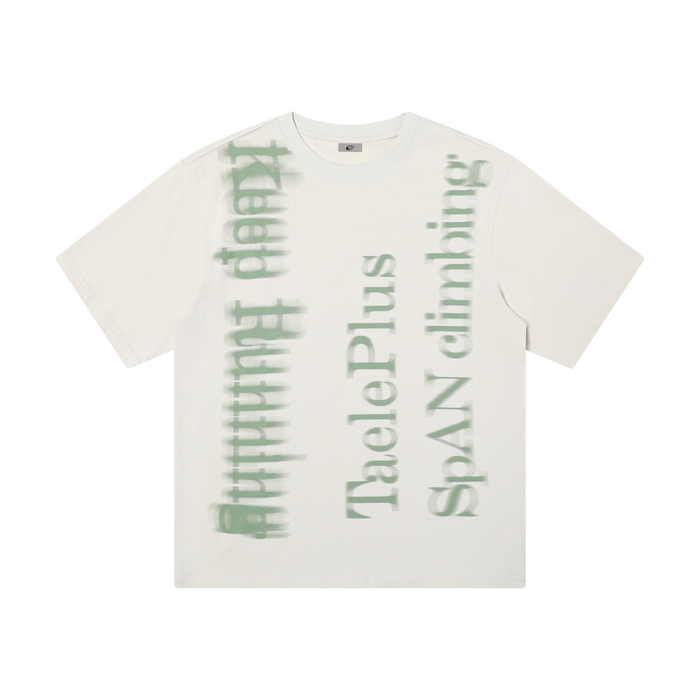 Oversized white graphic tee with blurred green vertical text print and washed streetwear style