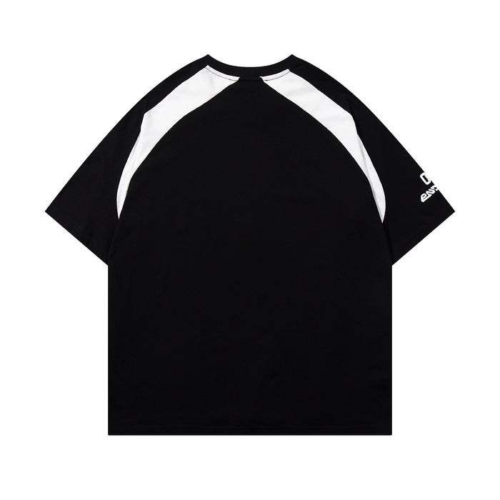 Black and white raglan streetwear tee with oversized fit and sporty varsity-inspired panel sleeves