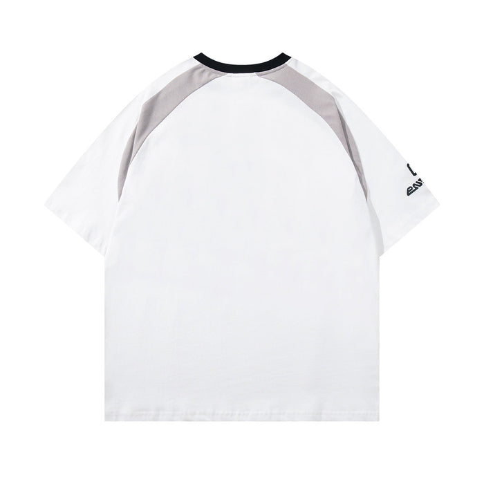 White varsity raglan tee with black collar, gray shoulder panels, and relaxed streetwear fit