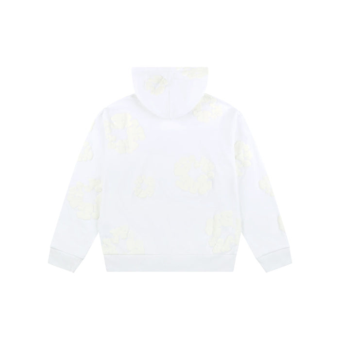 The White Monochrome “Cotton Wreath” Denim Tears Hoodie is shown from the back with faint light yellow cloud-like patterns, adding a subtle twist to minimal streetwear. The background is plain white.