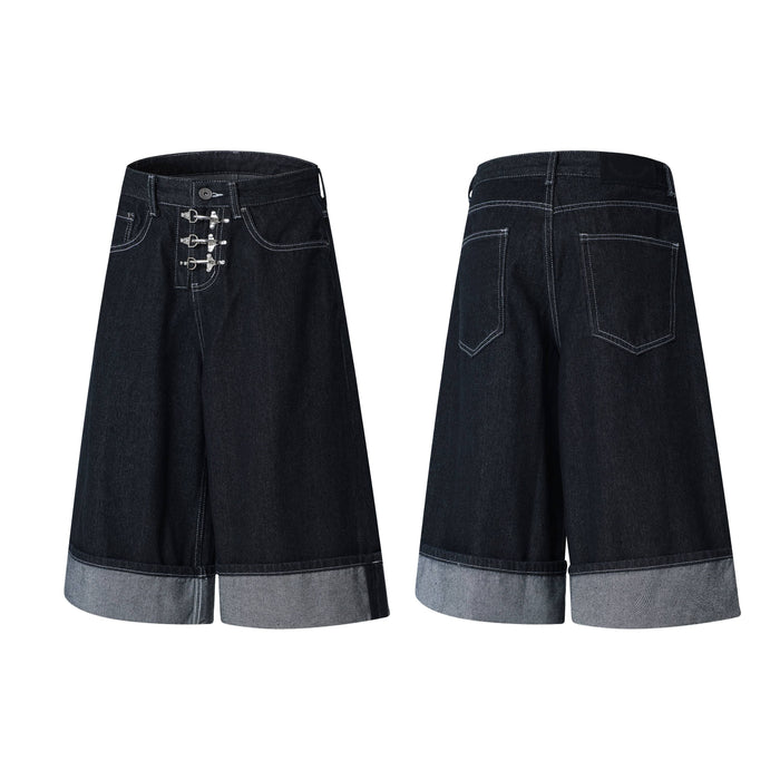 Front and back view of dark wash wide-leg denim shorts with silver buckle hardware and cuffed hem