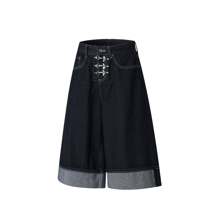 Front view of dark wash wide-leg denim shorts with three silver buckle closures