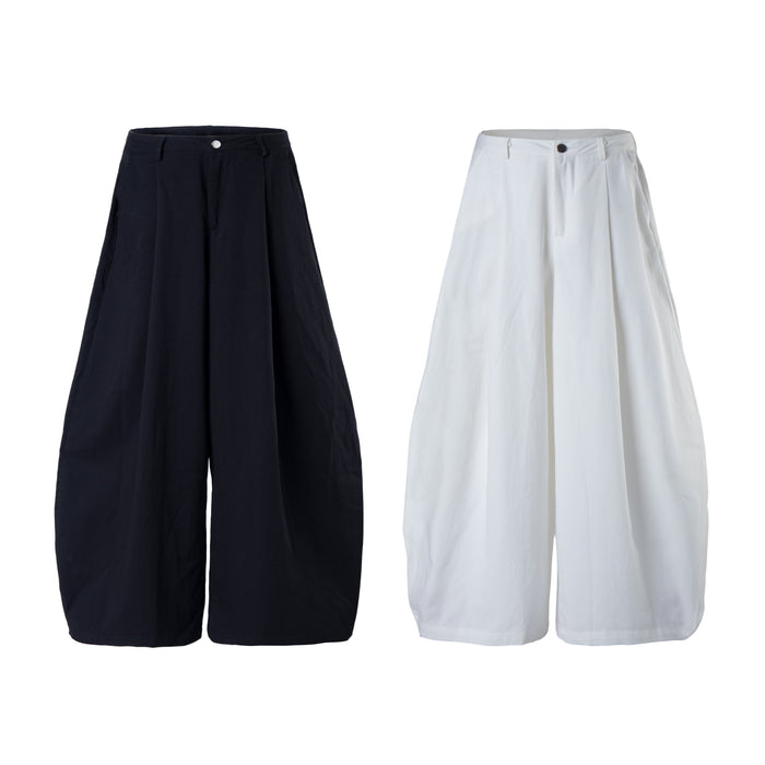 Wide-leg cargo pants in black and white, front view with minimal snap-button waist