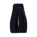 Black wide-leg cargo pants front view with multiple flap pockets and tie waist