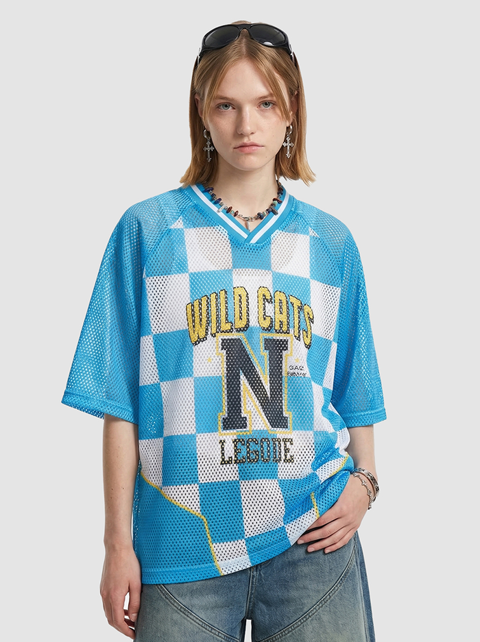Blue checkerboard mesh jersey T-shirt with Wild Cats N League graphic, V-neck trim, and relaxed fit on model