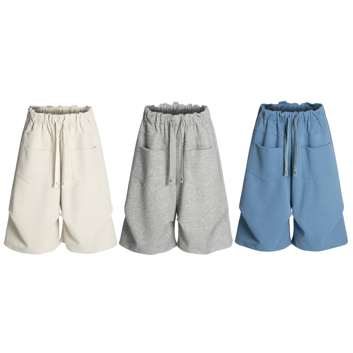Omirad Minimal Lounge Wide Shorts in cream, grey, and blue with elastic drawstring waist and patch pockets