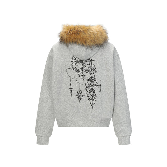 Back view of light gray zip hoodie with tan faux fur hood trim and black ornate gothic graphic